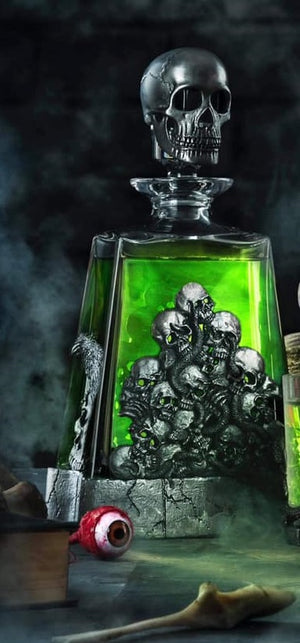 The Death Whisky Decanter made from Pewter in the uk, showing skulls all round the decanter and has a skull Decanter stopper on top.