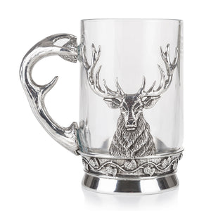 A tankard made from glass and pewter showing a stag design